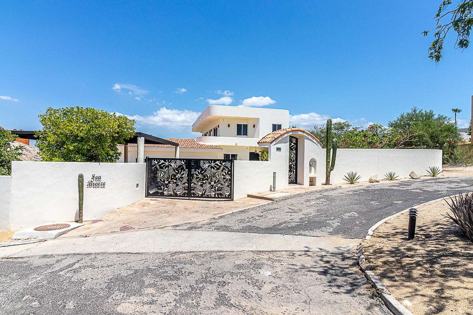 Maravilla Las Tunas The Nacuii Residence is a refined luxury home crafted to exceed the expectations of even the most discerning buyer. Nestled on a generous and private 3,000 m² lot (0.73 acres), it's just a short, effortless stroll to the untouched, sandy shores of Las Tunas — perfect for enjoying the serene coastal landscape and dramatic sunsets. The home offers a thoughtful layout with 3 spacious bedrooms, a separate studio, a cozy TV lounge, and 6 full bathrooms, including two principal suites, a guest room, a detached studio, and a dedicated media or family room. Expansive sliding glass doors invite natural light throughout the interiors while showcasing tranquil garden for sale