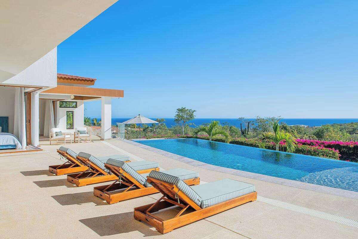 Maravilla La Noria Casa Lau'ren offers contemporary luxury with 4 bedrooms plus a private casita. Overlooking the Jack Nicklaus Signature Golf Course, this elegant home features ocean for sale