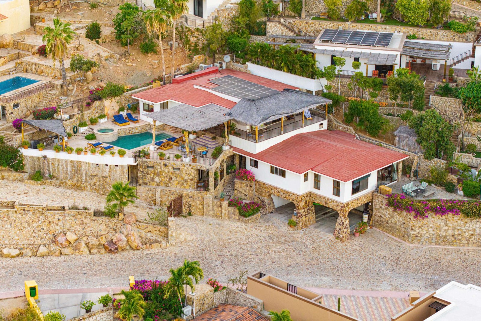 Maravilla Pedregal Csl Villa Felicidad is a 5-bedroom, 5.5-bath residence in Pedregal that combines scale, location, and proven income potential. Set just minutes from the main gate and within walking distance to the marina, it offers effortless access to Cabo's best dining and nightlife while maintaining privacy. The home features a private pool, expansive terraces, and panoramic marina – 25 Camino Grande Pedregal, Cabo San Lucas, BS