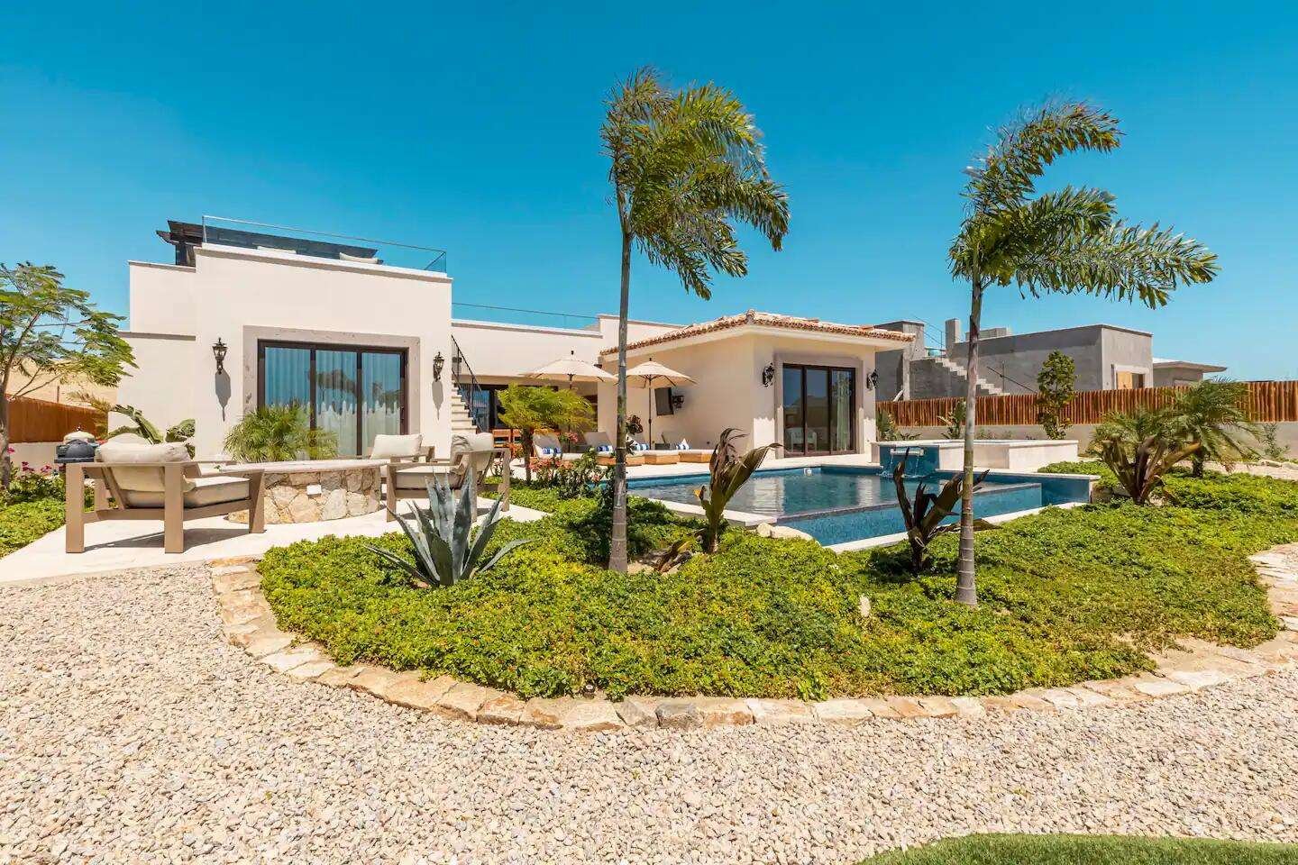 Maravilla Las Tunas The Nacuii Residence is a refined luxury home crafted to exceed the expectations of even the most discerning buyer. Nestled on a generous and private 3,000 m² lot (0.73 acres), it's just a short, effortless stroll to the untouched, sandy shores of Las Tunas — perfect for enjoying the serene coastal landscape and dramatic sunsets. The home offers a thoughtful layout with 3 spacious bedrooms, a separate studio, a cozy TV lounge, and 6 full bathrooms, including two principal suites, a guest room, a detached studio, and a dedicated media or family room. Expansive sliding glass doors invite natural light throughout the interiors while showcasing tranquil garden for sale
