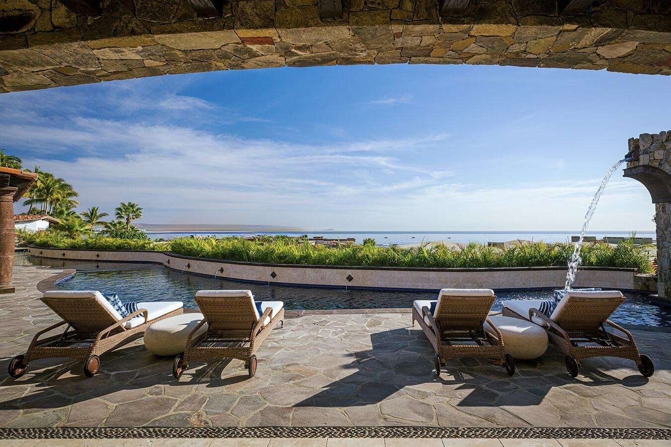 Maravilla Rancholasmargaritas Casa Playa Escondida - Oceanfront Luxury in Baja California SurPerched dramatically on the rocks above the Pacific Ocean, Casa Playa Escondida is a rare oceanfront retreat set along a secluded, pristine stretch of beach. Located within the exclusive off-grid gated community of Rancho Las Margaritas, this one-of-a-kind property offers privacy, tranquility, and breathtaking natural beauty--just a 20-minute drive to the dining and shopping of Cabo San Lucas, 40 minutes from Los Cabos International Airport, and approximately 30 minutes south of Cerritos and Todos Santos.The residence features three spacious ensuite bedrooms, each privately situated yet connected by terraces, pathways, and shared gathering spaces. A dedicated media room offers flexibility as a fourth bedroom or additional guest suite.Expansive terraces and multiple lounging areas provide a variety of vantage points to take in the surrounding landscape, from the rugged coastline to the endless Pacific horizon.The gourmet kitchen is equipped with high-end appliances and designed for both functionality and style. A warm and inviting living and dining area, anchored by a striking fireplace, creates the perfect space for entertaining or relaxing with family and friends. The home is offered fully furnished with includes modern off-grid conveniences such as solar power.Outdoor living is equally exceptional, featuring a swimming pool, firepit, grilling area, and multiple seating spaces--ideal for enjoying the serene coastal setting for sale