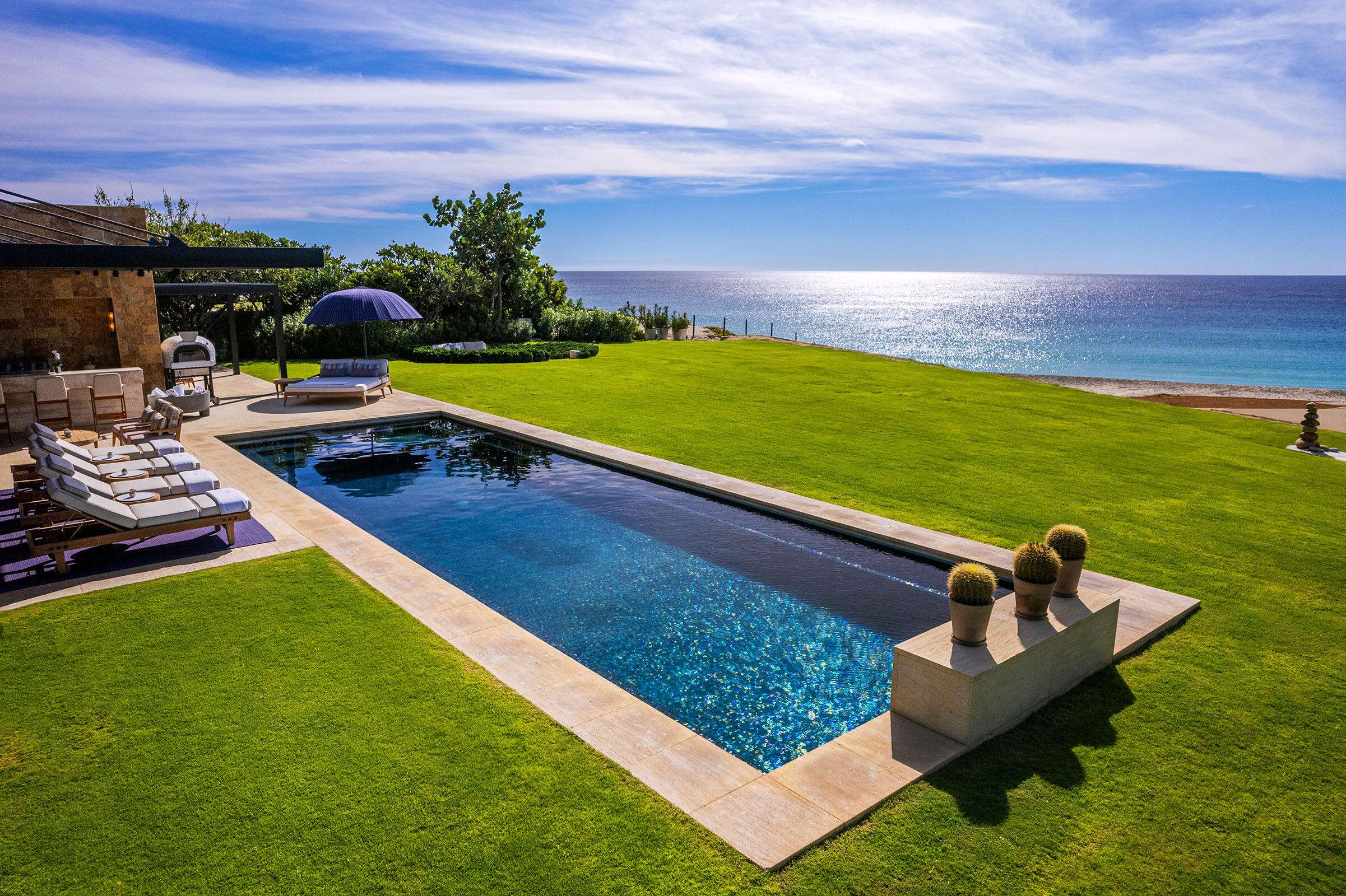 Maravilla Las Terrazas Set along the 15th hole of the El Cardonal Golf Course, panoramic vistas extend from rolling fairways to the Pacific, delivering striking sunrises and sunsets.This four-bedroom, 4.5-bath home blends refined design with seamless indoor-outdoor living. Open-concept interiors feature Palecek furnishings, while each bathroom showcases hand-painted Mexican tile for warmth and authenticity.Outdoor living includes a private pool and elevated hot tub, outdoor grill and wet bar, lush landscaping, and expansive terraces with golf course and ocean for sale