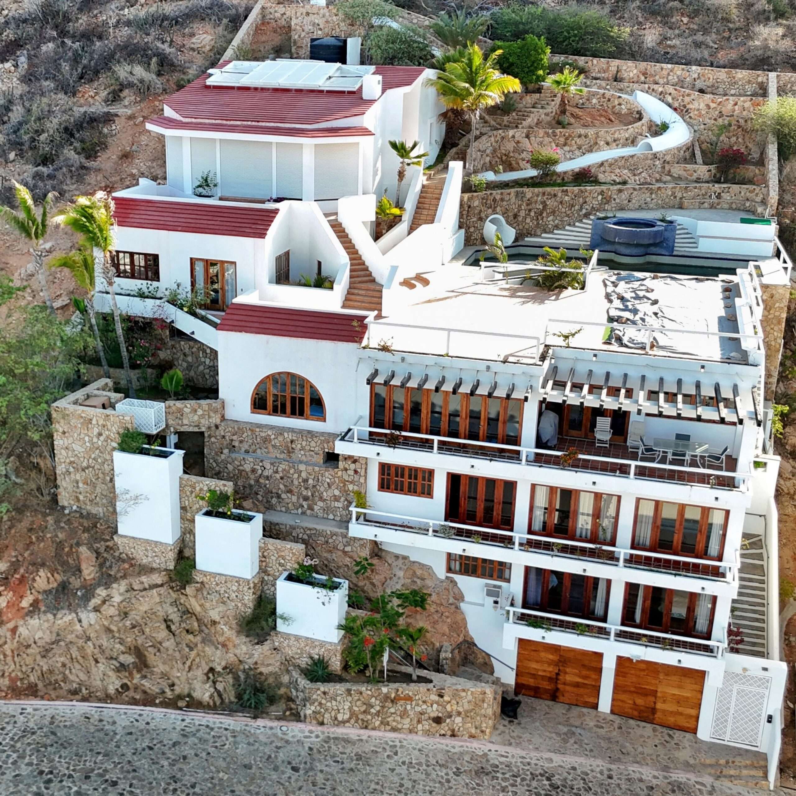 Maravilla Pedregal Csl Perched high above the marina and the Sea of Cortez, this extraordinary 10,000-square-foot estate is one of Pedregal's most iconic residences. Carved into the granite hillside, the property represents a remarkable piece of Cabo San Lucas history and offers an architectural experience unlike any other in Los Cabos.Panoramic for sale