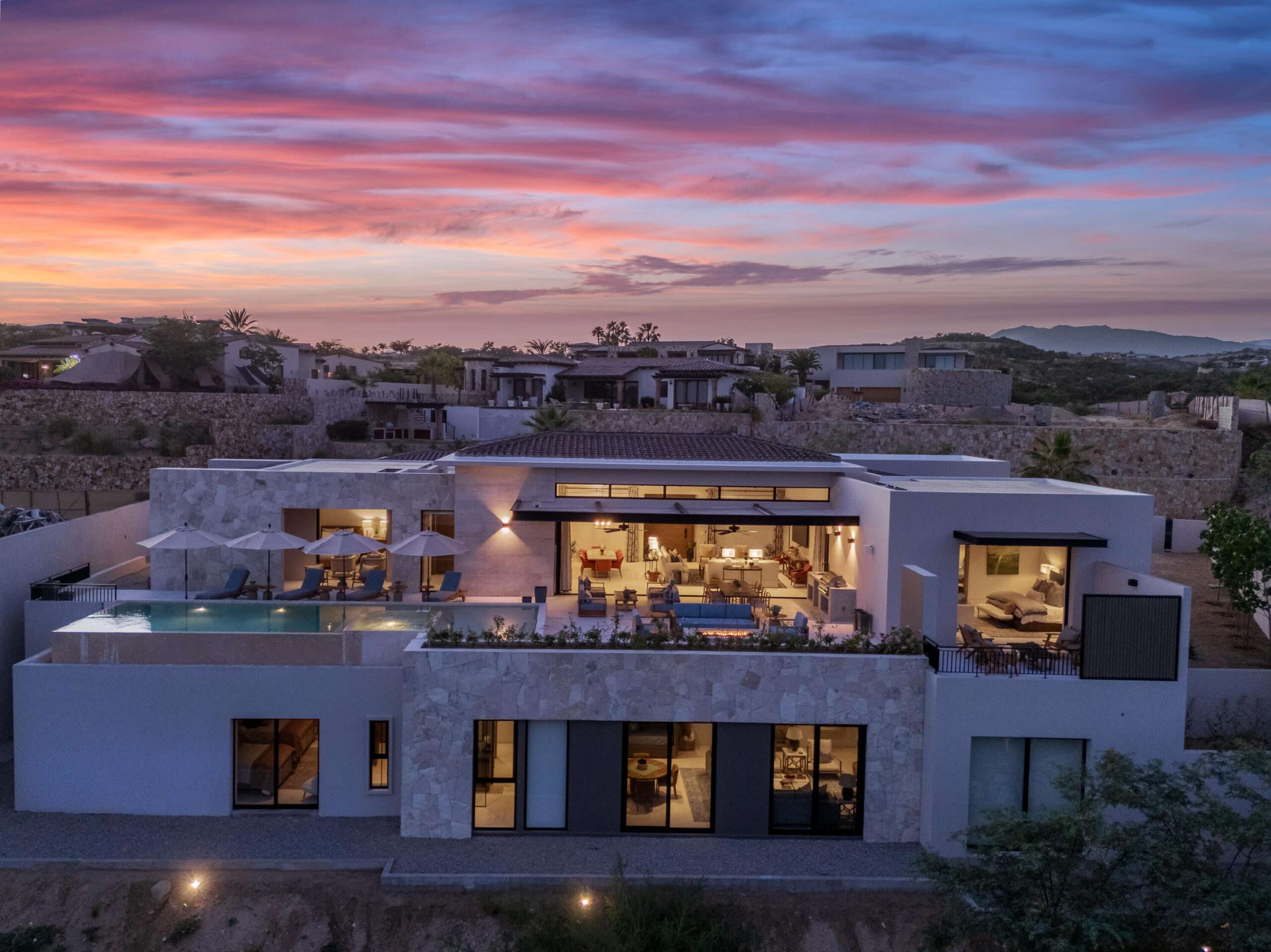 Maravilla Section 18- Horizontes Welcome to Horizontes 3, an exquisite custom-made home located within San José del Cabo's most sought-after community, Querencia. Surrounded by Tom Fazio's signature golf course, recognized as one of the best in the country, this stunning residence is just a short golf cart ride from the prestigious 5-star Club House. This remarkable 6-bedroom, 6.5-bathroom home elevates luxury living with a fresh vision of architecture and design. The layout features a cozy family room, an expansive bunk bed bedroom on the lower level, and a spacious maid's quarters with an independent entrance, making it ideal for entertaining family and friends.The property boasts outdoor living spaces, including tranquil green areas, an outdoor kitchen, an infinity pool, a jacuzzi, and ocean and ravine – 3 Querencia, San Jose Corridor, BS